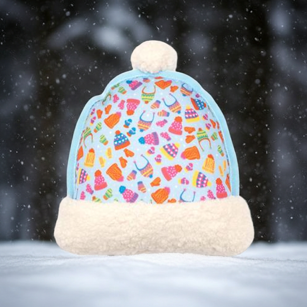 Colorful patterned hat-shaped pet toy with a fur base against a snowy background